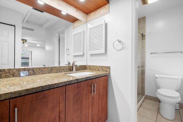 bathroom with tile patterned flooring, vanity, toilet, and walk in shower