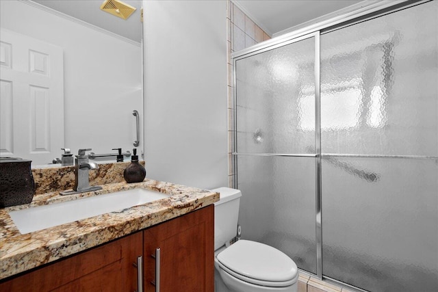 bathroom featuring crown molding, vanity, an enclosed shower, and toilet