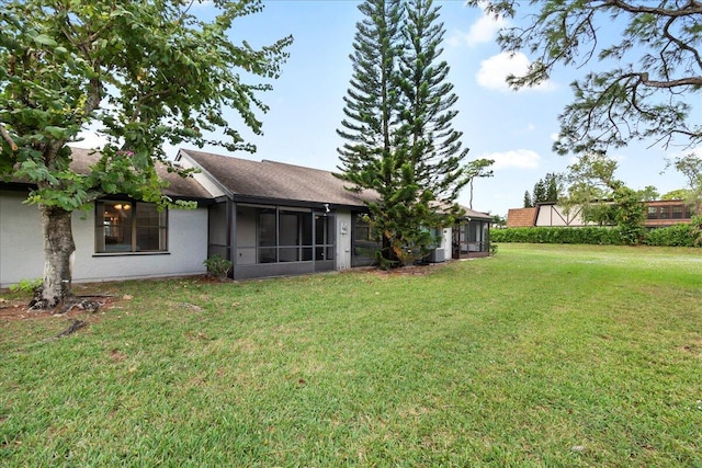 view of yard with a sunroom