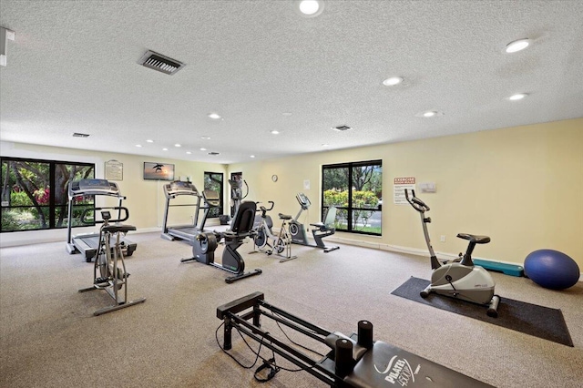 workout area with a textured ceiling