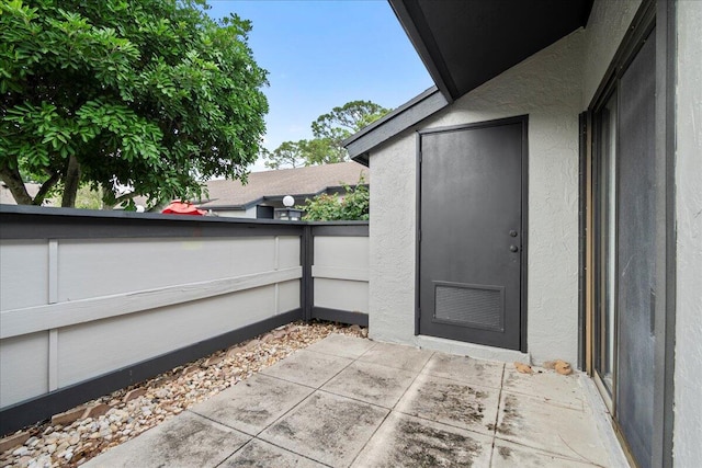 entrance to property with a patio area