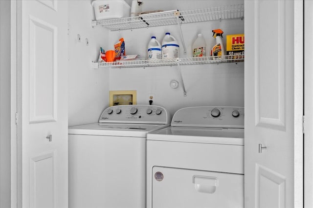 washroom with independent washer and dryer