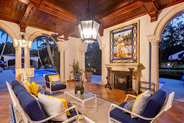 interior space featuring outdoor lounge area and ceiling fan