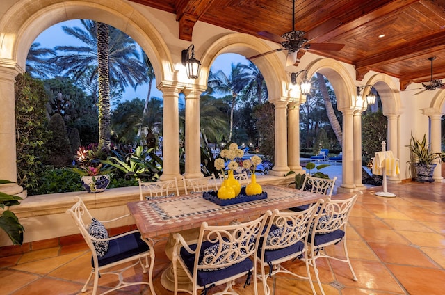 patio terrace at dusk with ceiling fan