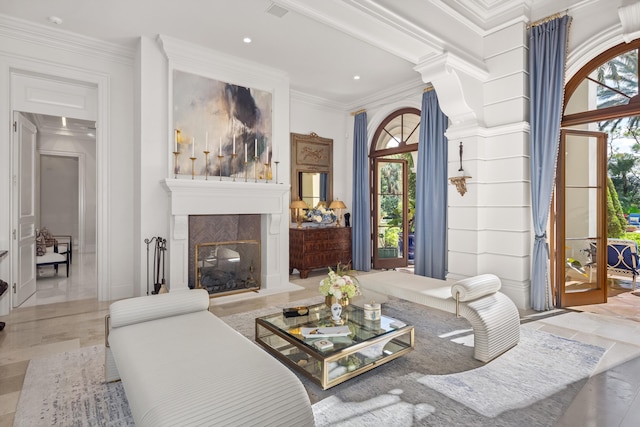 living room with ornamental molding, light hardwood / wood-style flooring, and a healthy amount of sunlight