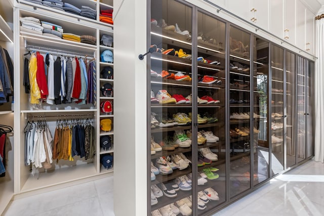 spacious closet featuring tile patterned floors