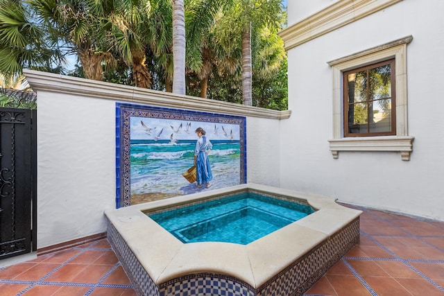 view of pool featuring an in ground hot tub