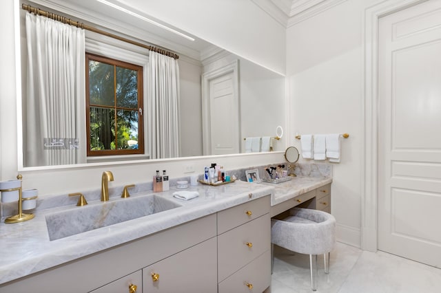 bathroom featuring tile patterned floors, vanity, and crown molding