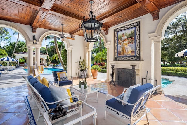 view of patio with an outdoor fireplace