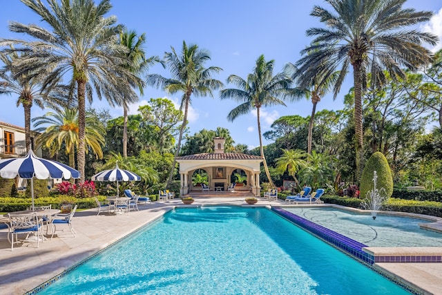 view of swimming pool featuring a gazebo and a patio area