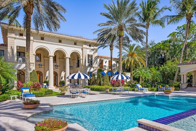 view of pool featuring a patio