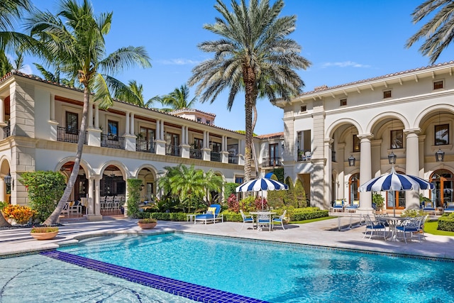 view of swimming pool featuring a patio area