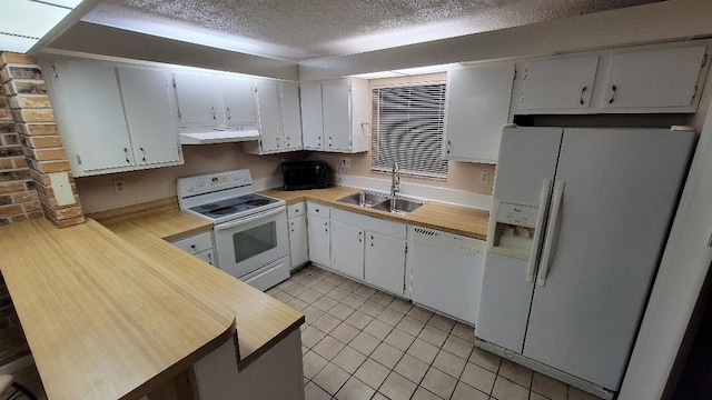 kitchen with white cabinetry, white appliances, sink, and range hood