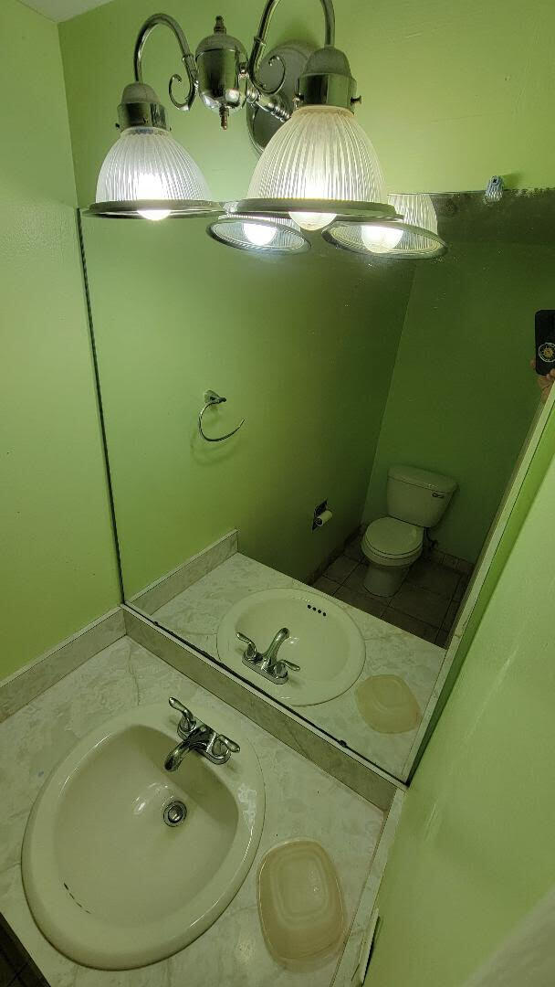 bathroom featuring vanity and toilet