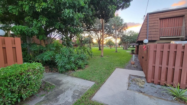 yard at dusk with a patio area