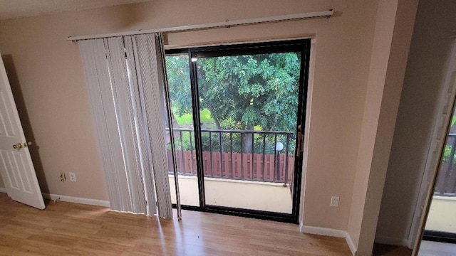 doorway to outside with light hardwood / wood-style flooring