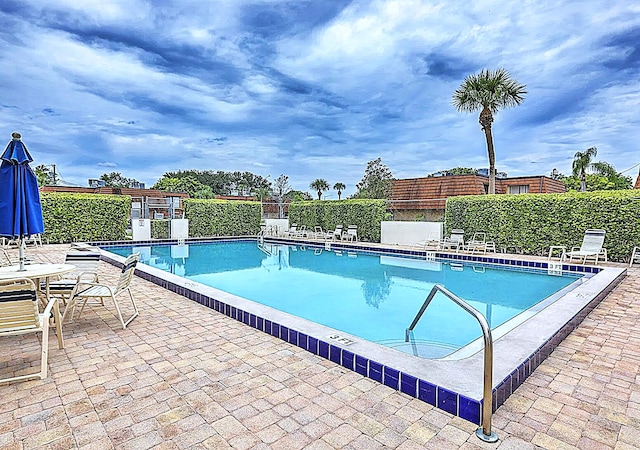 view of pool featuring a patio area