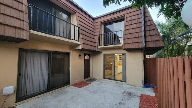 back of house with a patio area