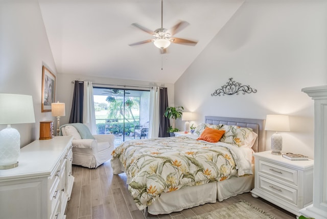 bedroom featuring access to outside, light hardwood / wood-style floors, ceiling fan, and lofted ceiling