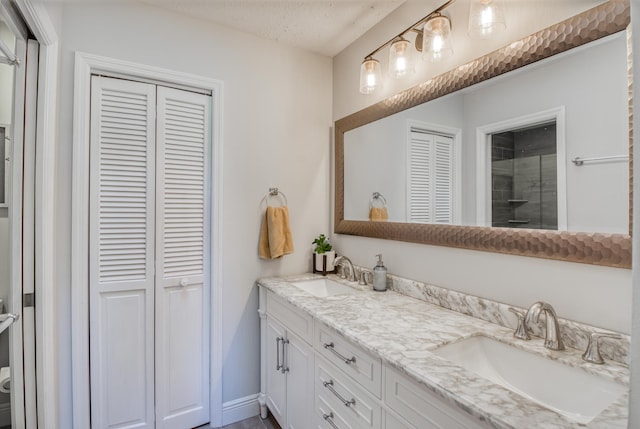 bathroom with vanity and a textured ceiling