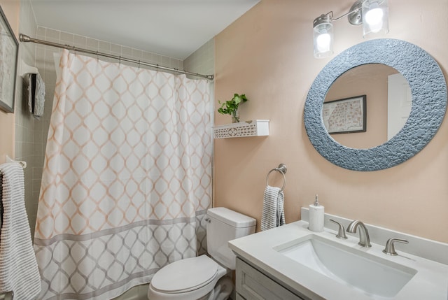 bathroom with vanity, toilet, and walk in shower