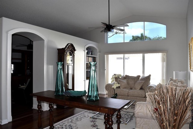 living room with vaulted ceiling and hardwood / wood-style flooring