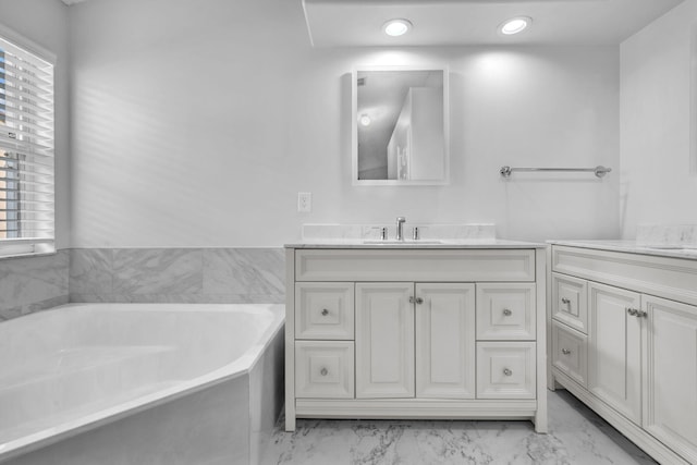 bathroom featuring a bathtub and vanity