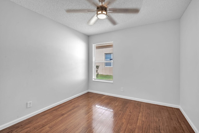 spare room featuring hardwood / wood-style floors, ceiling fan, and a textured ceiling