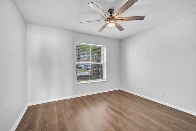 unfurnished room featuring hardwood / wood-style floors, ceiling fan, and a textured ceiling