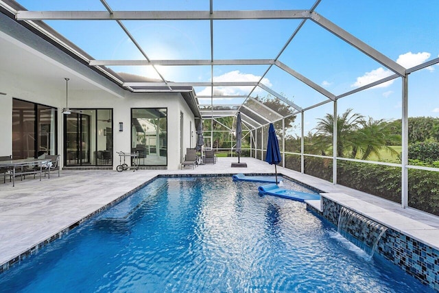 view of swimming pool featuring a lanai, a patio area, and pool water feature