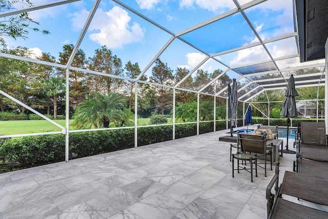 view of patio / terrace featuring glass enclosure