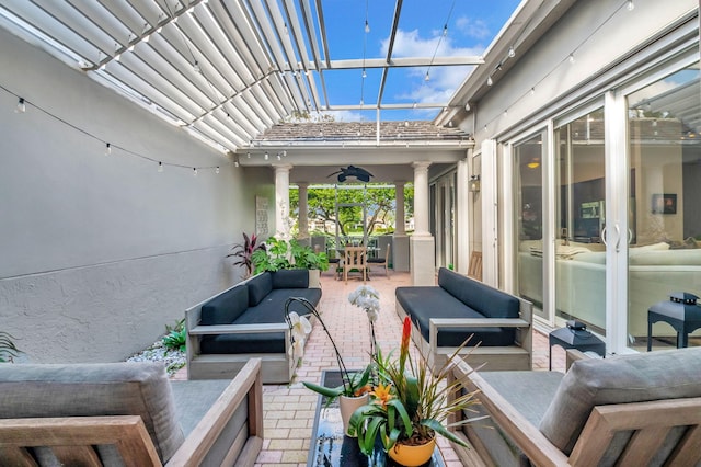 view of patio / terrace with an outdoor living space and ceiling fan