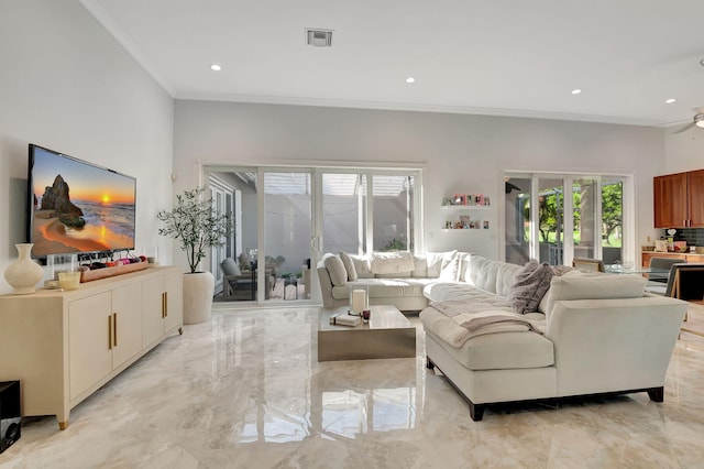 living room featuring ceiling fan and crown molding