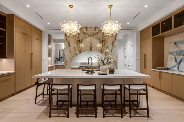 bathroom featuring a tile shower and a notable chandelier