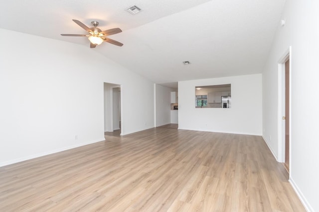 unfurnished living room featuring a textured ceiling, ceiling fan, light hardwood / wood-style flooring, and lofted ceiling