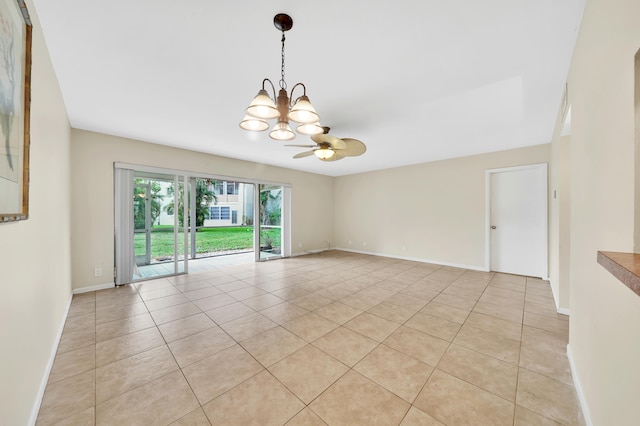 unfurnished room with light tile patterned floors and ceiling fan with notable chandelier