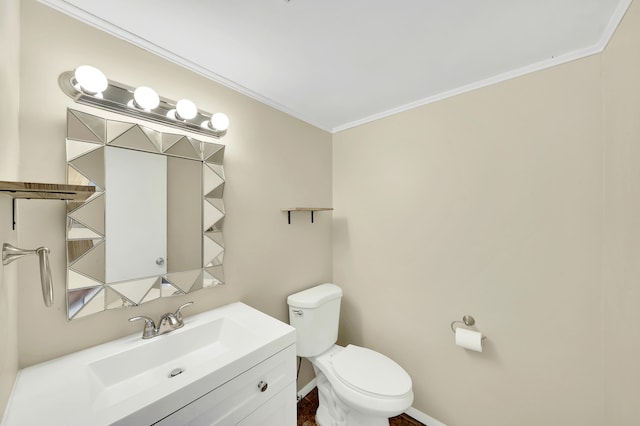 bathroom featuring crown molding, vanity, and toilet