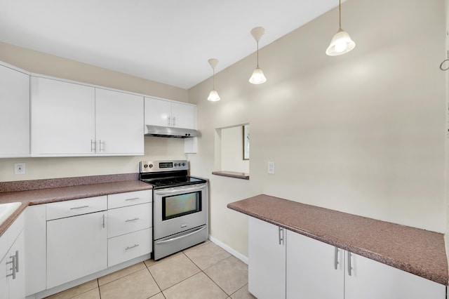 kitchen with vaulted ceiling, pendant lighting, light tile patterned floors, white cabinets, and stainless steel electric range oven