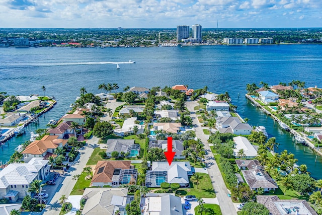 birds eye view of property featuring a residential view and a water view