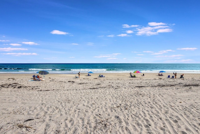 property view of water featuring a beach view