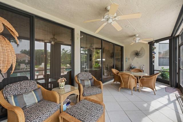 sunroom / solarium with ceiling fan