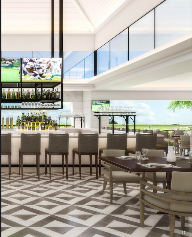 tiled living room with a towering ceiling