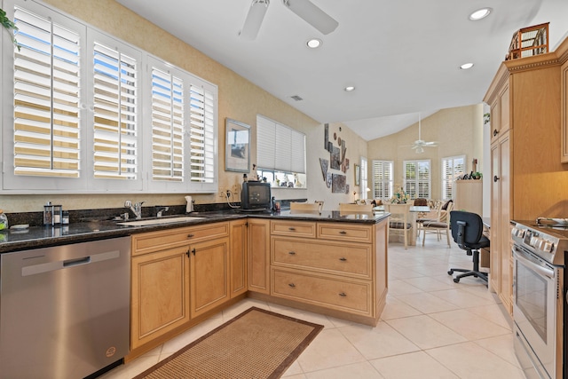 kitchen featuring stainless steel appliances, sink, kitchen peninsula, vaulted ceiling, and light tile patterned floors