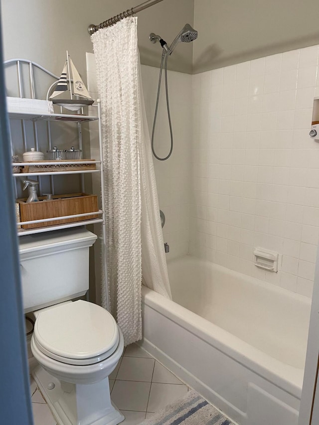 bathroom featuring tile patterned flooring, shower / bath combination with curtain, and toilet