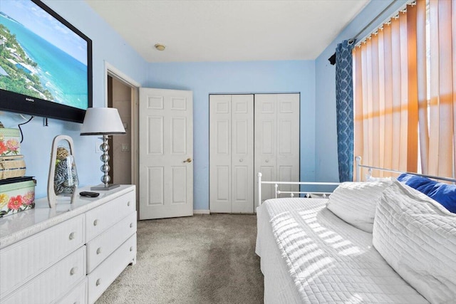 carpeted bedroom featuring a closet