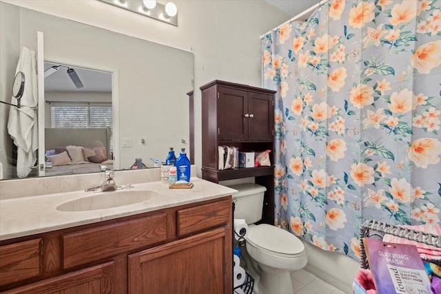 full bathroom featuring tile patterned flooring, vanity, toilet, and shower / tub combo with curtain