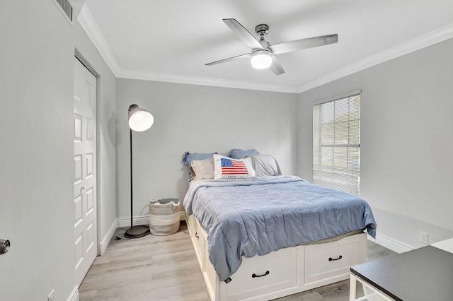 bedroom with ceiling fan, light hardwood / wood-style flooring, and crown molding