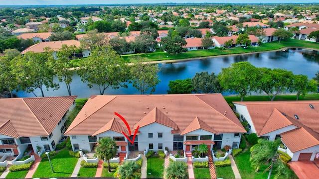 drone / aerial view featuring a water view