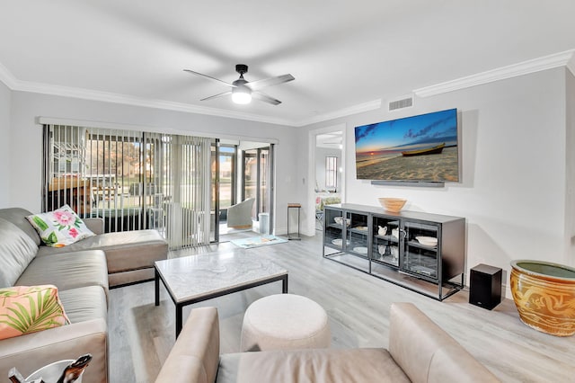 living room featuring ceiling fan, light hardwood / wood-style floors, and crown molding