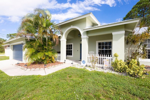 view of front facade with a garage and a front yard